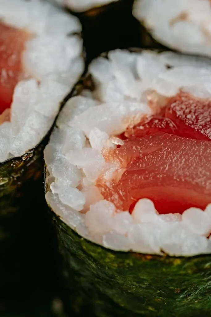 hosomaki - a close up of sushi with a lot of sushi sauce on it